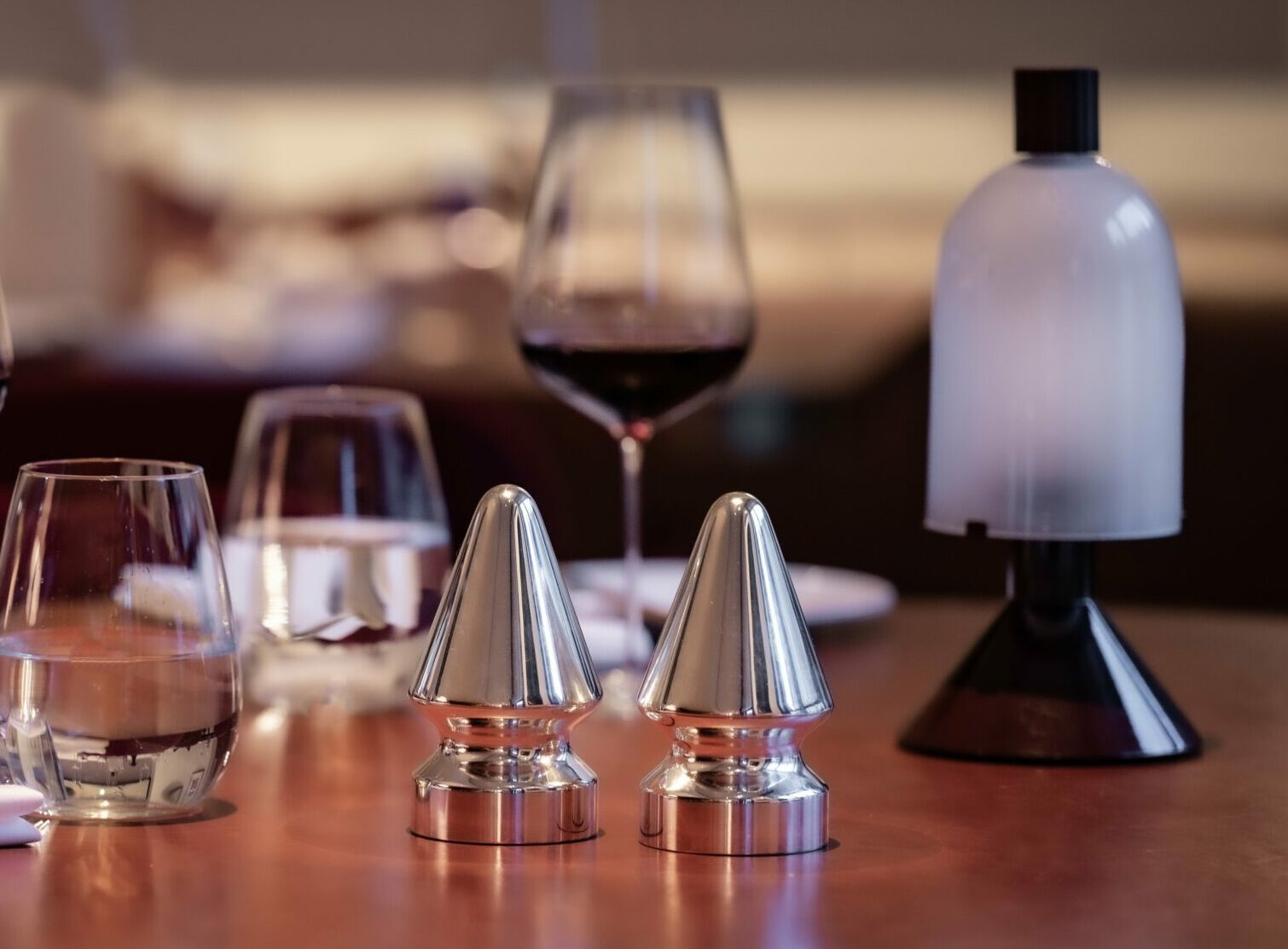 A salt and pepper dispensers on a table