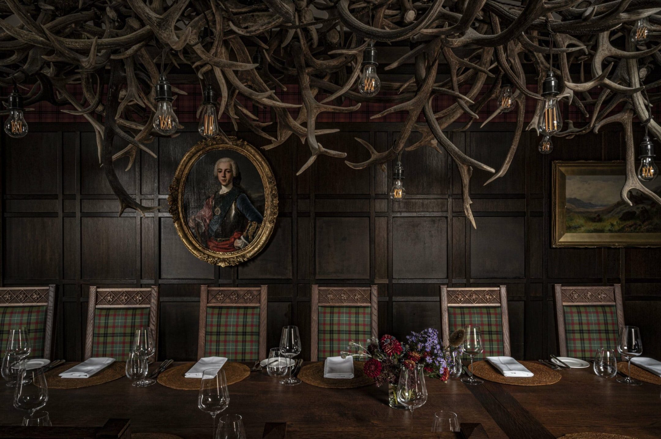 A section of the 9-metre table and tartan upholstered chairs in Scottish oak in The Scottish Room on the third floor