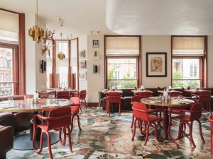 Mount St. Restaurant by day – a view of the restaurant with tables set and art in the background