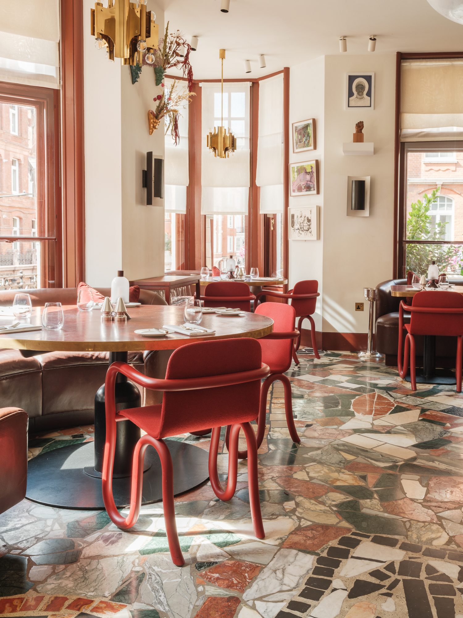 Mount St. Restaurant by day – a view of the restaurant with tables set and art in the background